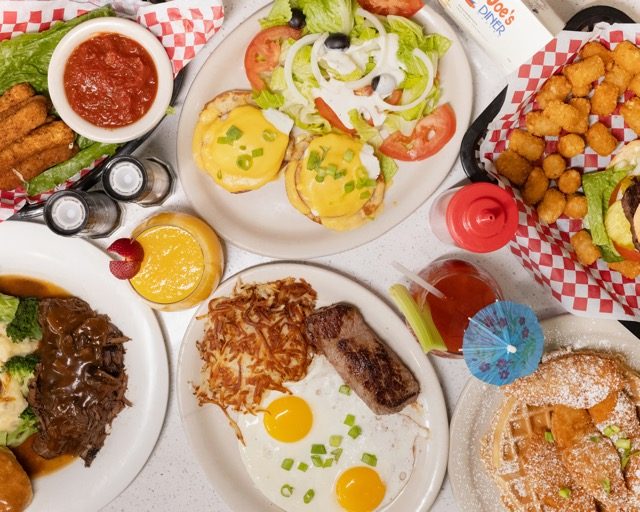 A hearty American breakfast spread with biscuits, eggs and bacon at Joe's Naples Park Diner